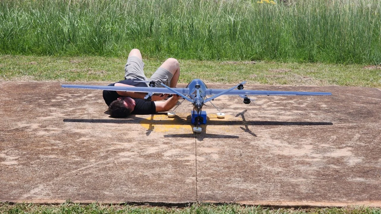 Technician working on an aircraft at a field site